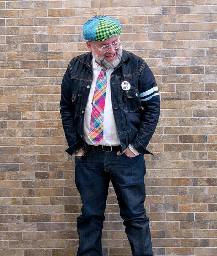 Marty Finestone Marty Finestone standing against a brick wall